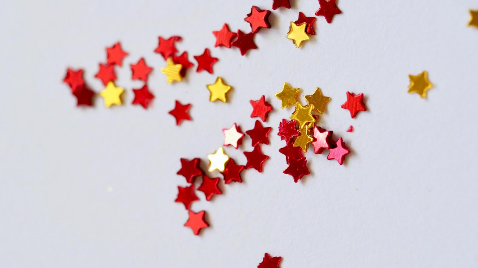 red and gold stars on a white background